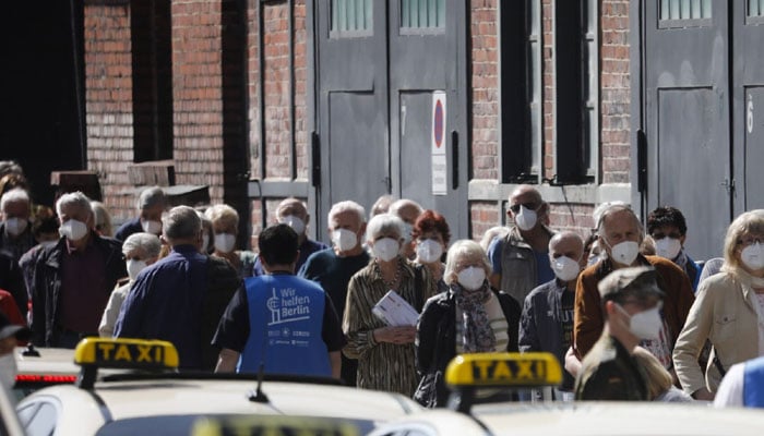 People line up in front of a vaccination center at the Arena Treptow in Berlin, Germany. Photo: AP/file