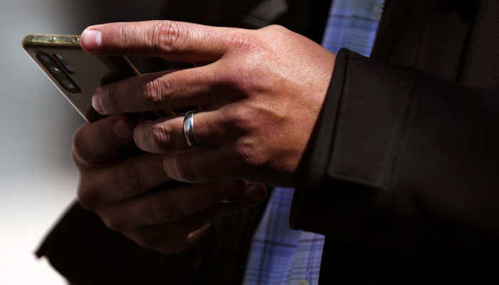 A man holds a mobile phone in Mexico City, Mexico, February 3, 2021. — Reuters/File