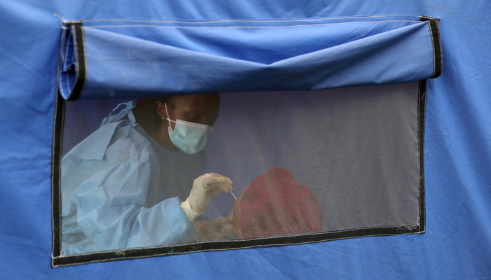 A traveller is tested for COVID-19 at the Grasmere Toll Plaza, Lenasia, South Africa, January 14, 2021. — Reuters/File