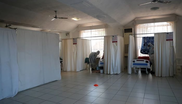 Healthcare workers assist patients being treated at a makeshift hospital run by charity organisation The Gift of the Givers, during the coronavirus disease (COVID-19) outbreak in Johannesburg, South Africa, July 11, 2021. — Reuters/File