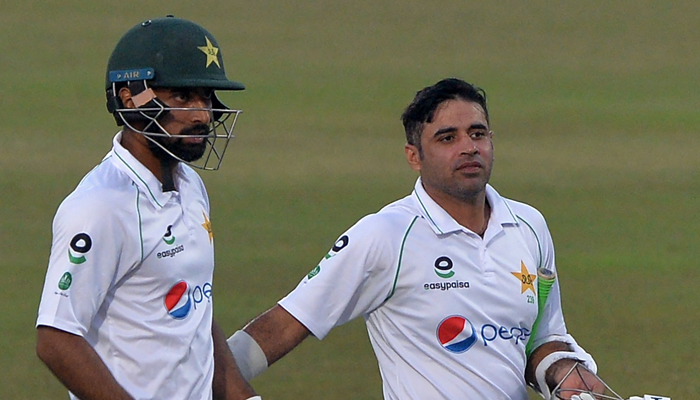 Pakistans Abid Ali (R) and Abdullah Shafique walk back to the pavilion at the end of the second day play of the first Test cricket match between Bangladesh and Pakistan at the Zahur Ahmed Chowdhury Stadium in Chittagong on November 27, 2021. — AFP