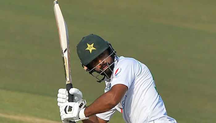 Abdullah Shafique tracks the ball after glancing it fine. Photo: AFP