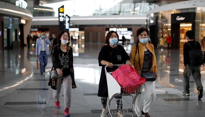Chinas daily COVID cases could reach over 630,000 if it adopts the United States pandemic strategy, warns study. Photo: Reuters/file   .