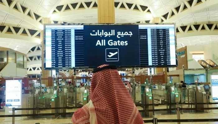 A Saudi man checks the flight timings at the King Khalid International Airport in Riyadh, Saudi Arabia. — Reuters