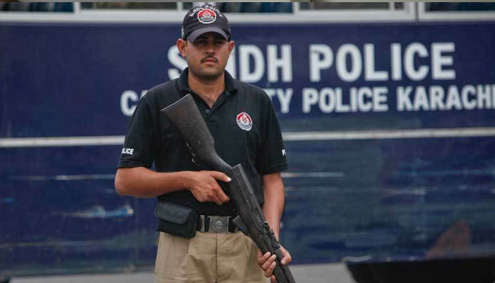 A policeman stands alert in Karachi in this file photo. — Reuters