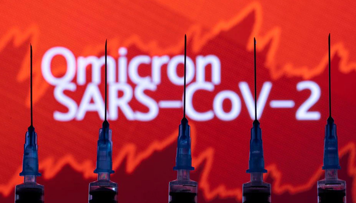 Syringes with needles are seen in front of a displayed stock graph and words Omicron SARS-CoV-2 in this illustration taken, November 27, 2021. — Reuters/File
