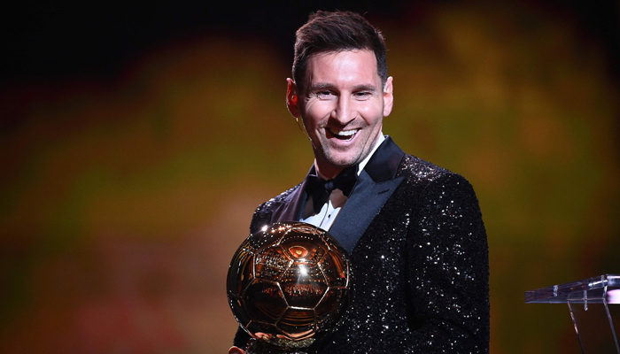 Paris Saint-Germains Argentine forward Lionel Messi reacts after being awarded the Ballon d´Or award during the 2021 Ballon d´Or France Football award ceremony at the Theatre du Chatelet in Paris on November 29, 2021. — AFP