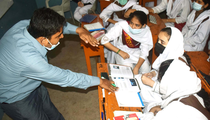 Teacher gives lecture in a class room at at school in Hyderabad on October 10, 2021. — INP/File