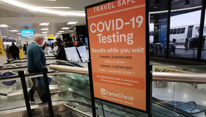 A COVID-19 testing facility is advertised at Newark Liberty International Airport on November 30, 2021 in Newark, New Jersey.-AFP