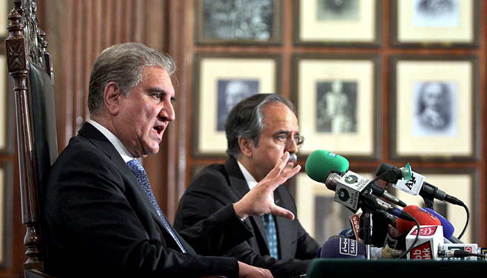 Foreign Minister Makhdoom Shah Mahmood Qureshi briefing the media on the upcoming 17th Extraordinary Session of the OIC Council of Foreign Ministers in Lahore on December 4, 2021. — APP