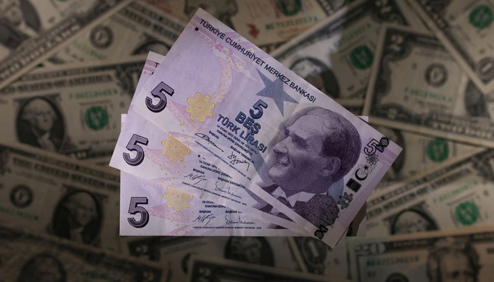 Turkish lira banknotes are seen placed on U.S. Dollar banknotes in this illustration taken, November 28, 2021. — Reuters/File