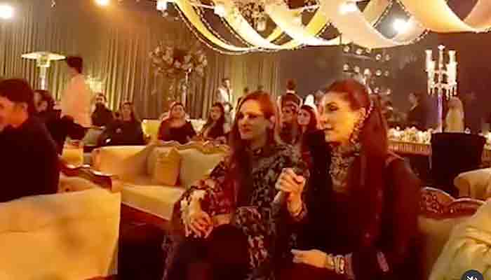 Maryam Nawaz crooning a Bollywood song at her sons wedding reception. Screngrab