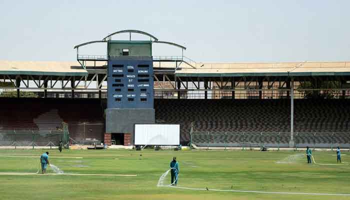 Staff waters the grass at the National Stadium in Karachi. Photo: AFP