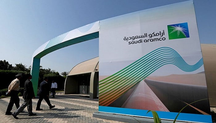 The logo of Aramco is seen as security personnel walk before the start of a press conference by Aramco at the Plaza Conference Center in Dhahran, Saudi Arabia November 3, 2019. Photo: Reuters