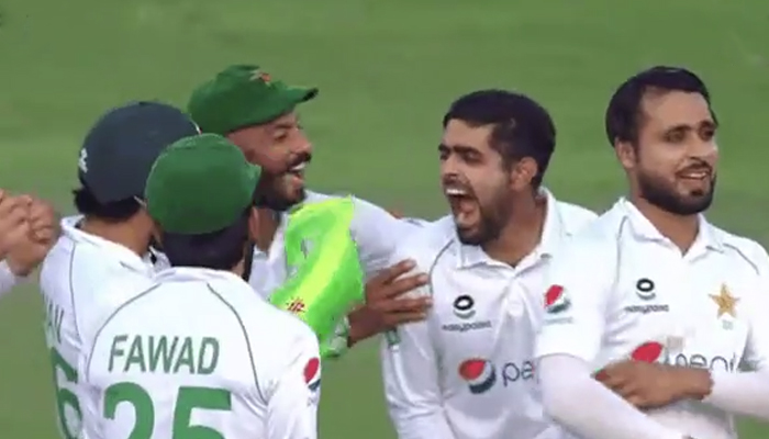 Pakistan skipper Babar Azam celebrates after taking Mehidy Hasan Mirazs wicket during the the final day of the second Test cricket match between Bangladesh and Pakistan at the Sher-e-Bangla National Cricket Stadium in Dhaka on December 8, 2021. — Twitter