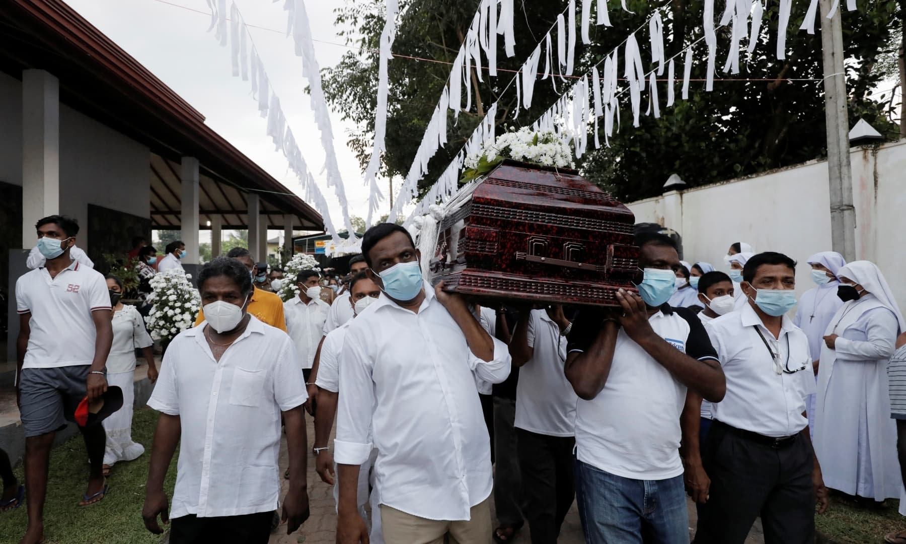 People bringing coffin of Priyantha Kumara to cemetery. Photo: Reuters