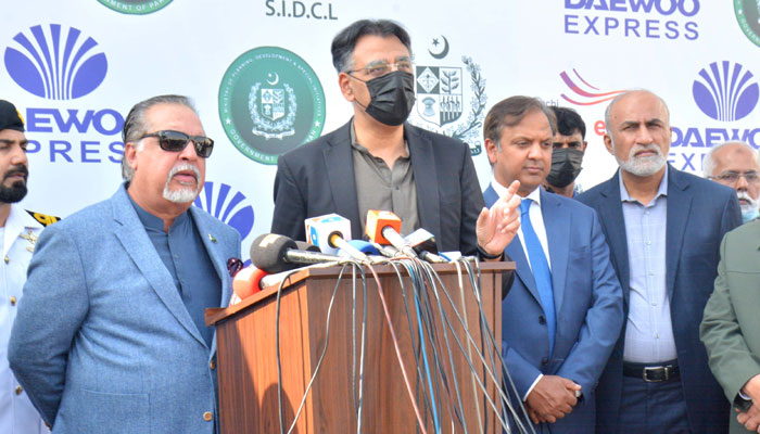 Federal Minister for Planning, Development and Special Initiatives Asad Umar along with Governor Sindh Imran Ismail, talking to media persons after visiting Operation Centre Karachi Green Line Bus Transit System in Karachi on December 9, 2021. — PID