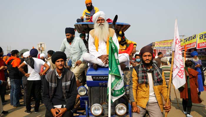 Farmers sit on a tractor during a protest against the newly passed farm bills at Singhu border near Delhi, India, December 5, 2020. — Reuters/Adnan Abidi