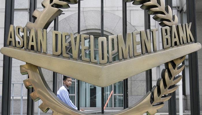 A worker walks past inside the Asian Development Bank (ADB) headquarters in Manila June 17, 2009. — Reuters/File