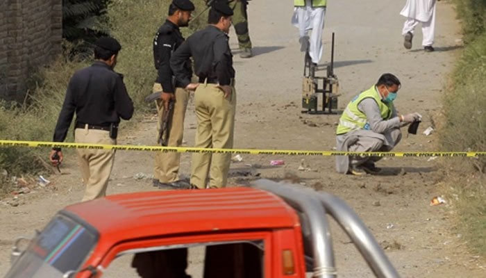 Police officials inspecting the crime scene after the shootout. — Twitter