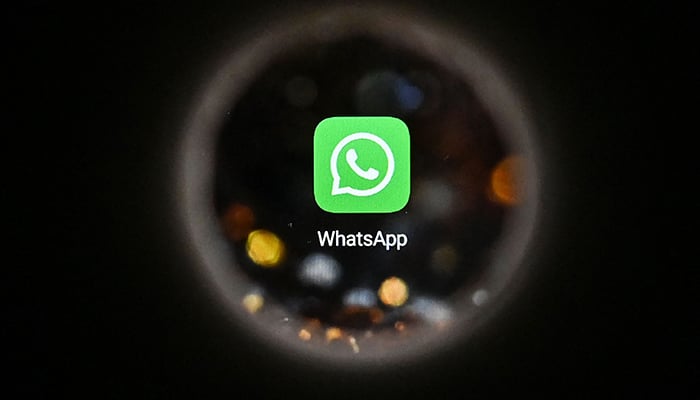 This picture taken in Moscow on October 5, 2021 shows the US instant messaging software WhatsApp logo on a smartphone screen. — AFP