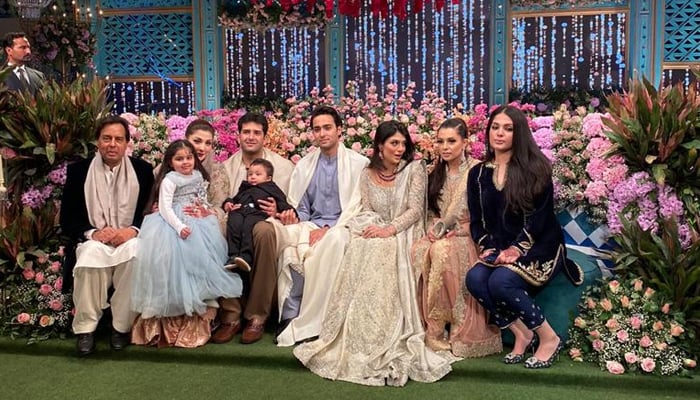 The groom, Junaid Safdar, and his wife, Ayesha Saif, pose with family members — social media