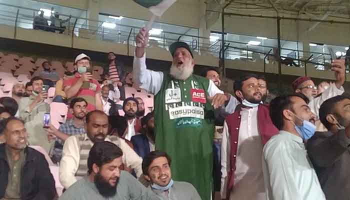 Chacha Cricket waves Pakistans flag from the stands during the first Pakistan-West Indies T20 match in Karachi. Photo: Twitter
