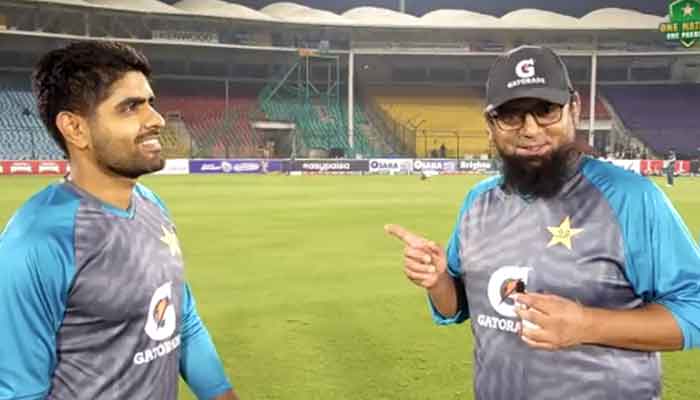 Saqlain Mushtaq and Babar Azam pictured during the match. Photo: PCB Twitter video