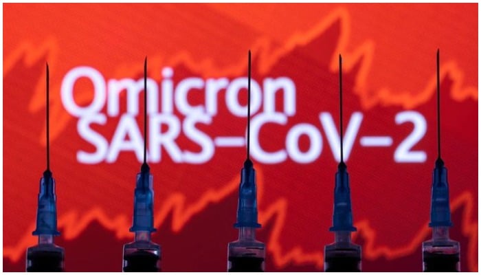 Syringes with needles are seen in front of a displayed stock graph and words Omicron SARS-CoV-2 in this illustration taken, November 27, 2021. — Reuters/File