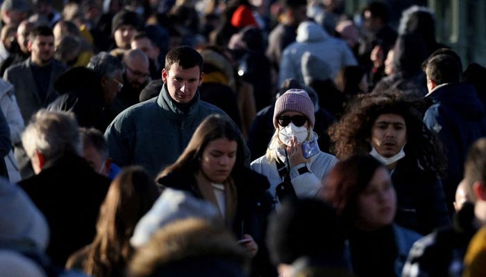 People walk across Westminster Bridge after new measures were announced yesterday due to the Omicron coronavirus variant, in London, Britain, November 28, 2021. — Reuters/File