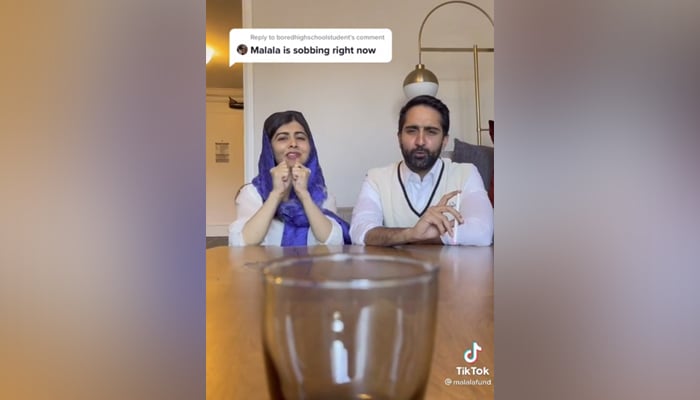 Nobel prize winner Malala Yousafzai (left) and her husband Asser Malik (right) playing a game to decide their New Year resolution. — TikTok/MalalaFund