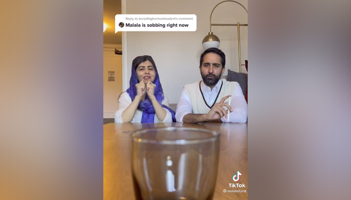 Nobel prize winner Malala Yousafzai (left) andher husband Asser Malik (right) playing a game to decide their New Year resolution. — TikTok/MalalaFund