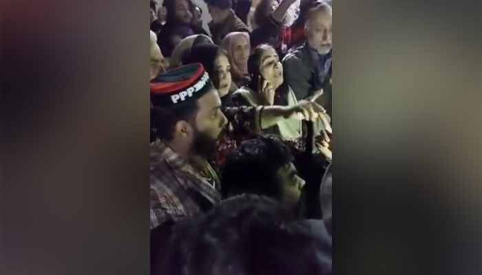 PPP and ANP workers protesting outside a polling station in Peshwar, on December 18, 2021. — Twitter