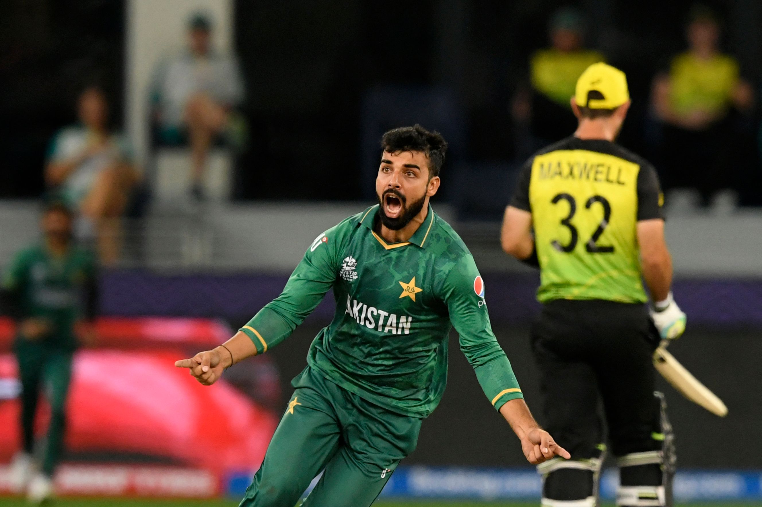 Pakistans Shadab Khan celebrates after taking the wicket of Australias David Warner (not pictured) during the ICC mens Twenty20 World Cup semi-final match between Australia and Pakistan at the Dubai International Cricket Stadium in Dubai on November 11, 2021. — QURESHI / AFP