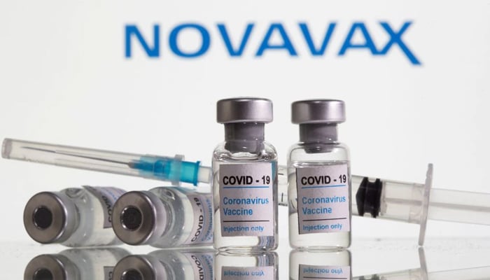 Vials labelled COVID-19 Coronavirus Vaccine and sryinge are seen in front of displayed Novavax logo in this illustration taken, February 9, 2021. — Reuters/File