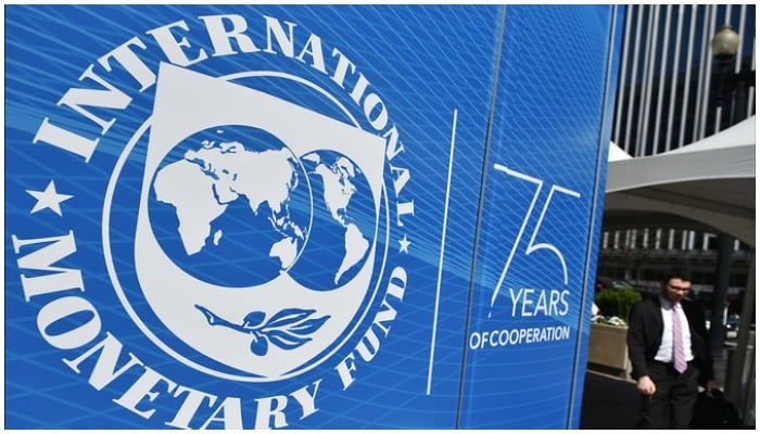 The seal of the International Monetary Fund (IMF) is seen outside of the headquarters building in Washington, DC on April 8, 2019. (AFP/File)