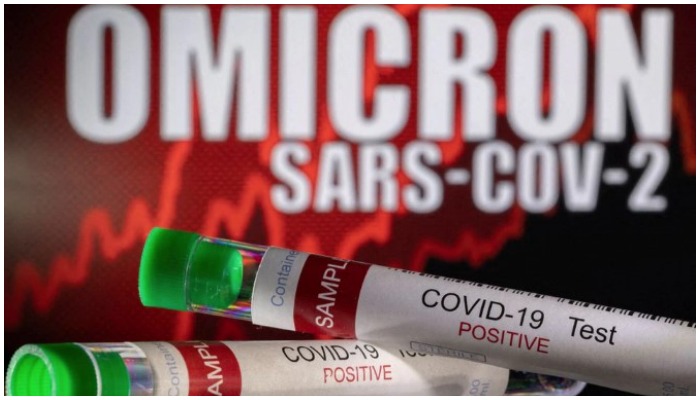 Test tubes labelled COVID-19 Test Positive are seen in front of displayed words OMICRON SARS-COV-2 in this illustration taken December 11, 2021. — Reuters/Dado Ruvic/Illustration