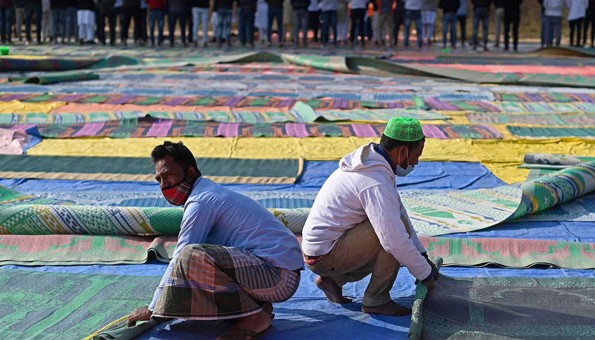 In this file photo taken on December 17, 2021, Muslim devotees roll mats after offering Friday prayers in an open ground in Gurgaon, after several prayer sites were closed by the authorities following demands by right wing Hindu groups calling for banning Muslim prayers in open spaces. — AFP