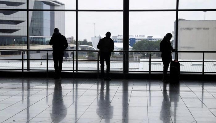Passengers wait to board international flights, amidst the spread of the new SARS-CoV-2 variant Omicron, at OR Tambo International Airport in Johannesburg, South Africa, November 28, 2021.&mdash; Reuters/File