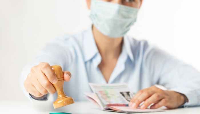 US will waive in-person interviews for H-1B and other visas in 2022 2 Representational image of an official issuing visa. Photo: Stock file