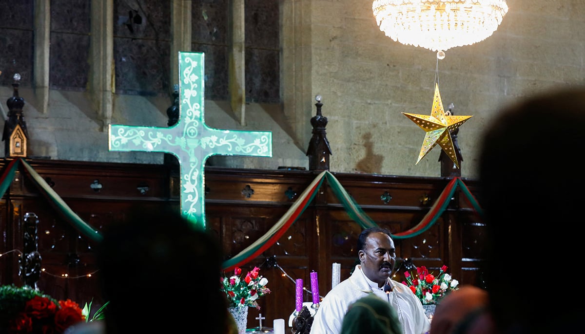 Pastor Shamoon leads the Christmas Eve service at St. Andrews Church in Karachi, Pakistan, December 24, 2021. — Reuters