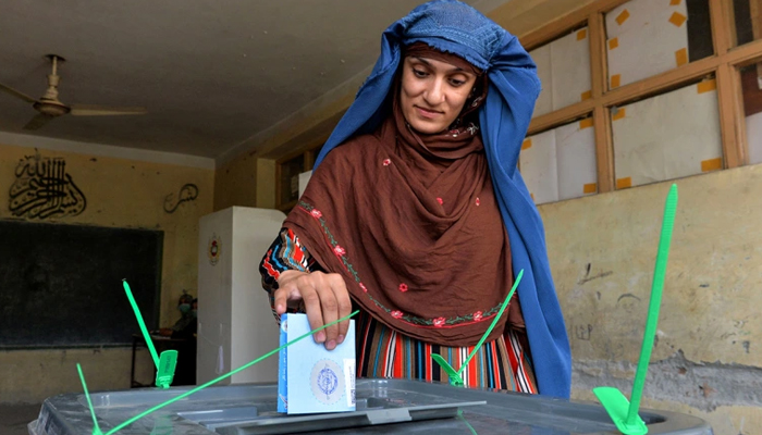 A woman casts her vote at a polling station in Jalalabad on September 28, 2019. — AFP/File