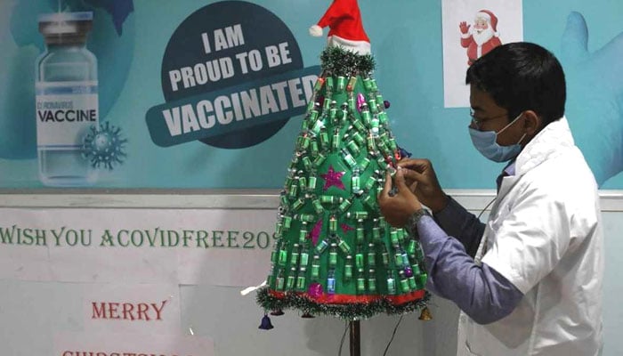A healthcare worker decorates a Christmas tree at the Lions Club of Calcutta Kankurgachhi Netralaya & Research Institute in Kolkata. File photo
