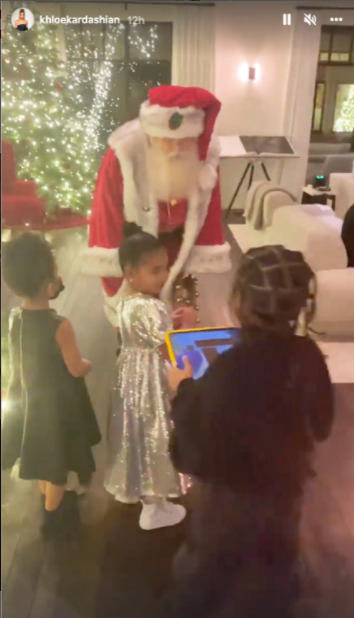 Khloé Kardashian and daughter True twin in glam silver dresses on Christmas eve