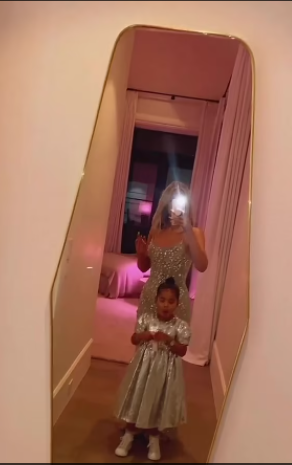 Khloé Kardashian and daughter True twin in glam silver dresses on Christmas eve