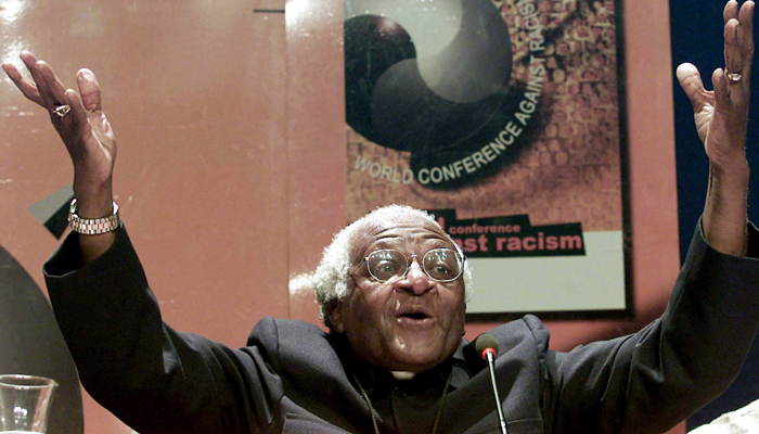 Nobel Peace laureate Archbishop Desmond Tutu gestures as he addresses journalists at the World Conference Against Racism (WCAR), September 5, 2001. Tutu made a call for reparations for slavery saying that they would be like a balm to the wounds of Africas past. — Reuters/Juda NgWenya/File Photo