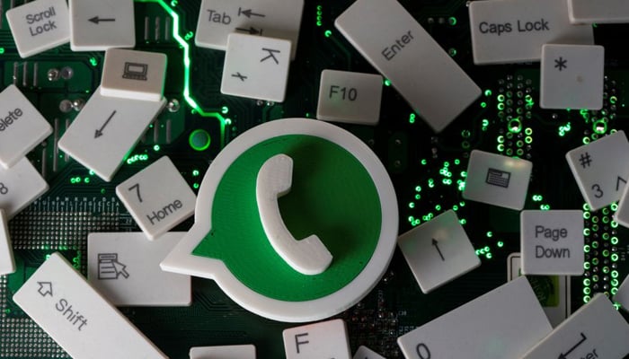 A 3D printed WhatsApp logo and keyboard buttons are placed on a computer motherboard in this illustration taken January 21, 2021. — Reuters/File