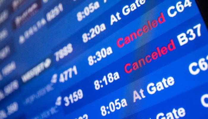 A screen showing cancelled flights is seen at John F. Kennedy International Airport during the spread of the Omicron coronavirus variant in Queens, New York City, US, December 26, 2021. — Reuters/File