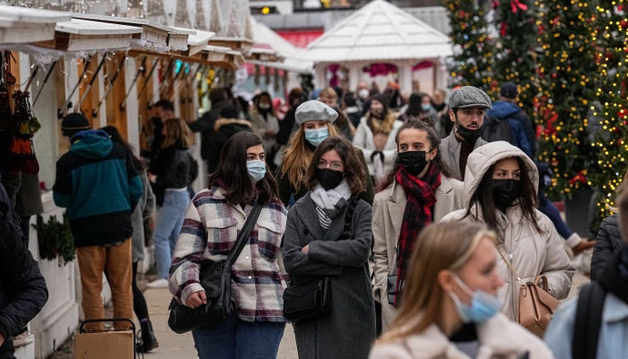 Shoppers are wearing face masks as protection against COVID-19 in a Christmas market at Tuilerie garden in Paris, France. File photo