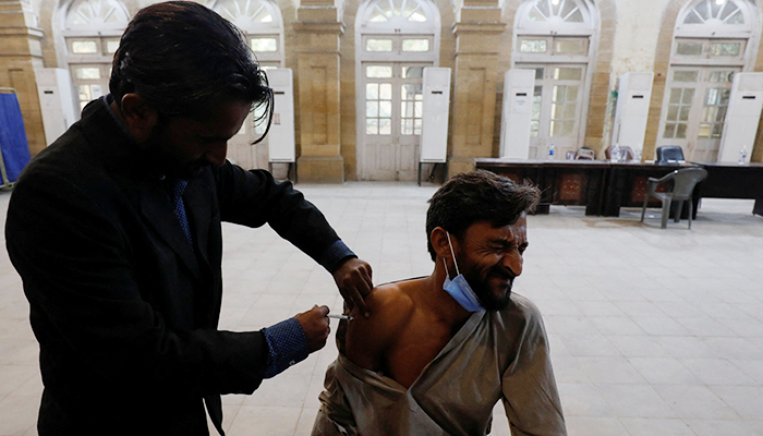 A man reacts as he receives a dose of the coronavirus disease (COVID-19) vaccine at a vaccination centre in Karachi, Pakistan December 27, 2021. — Reuters/File